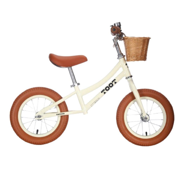 Bicicleta de equilíbrio infantil TOOT Totito em cor creme.